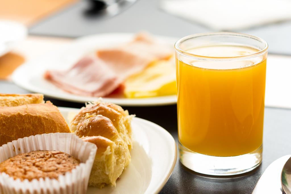 Grand Bittar Hotel Brasília Exterior foto A glass of orange juice
